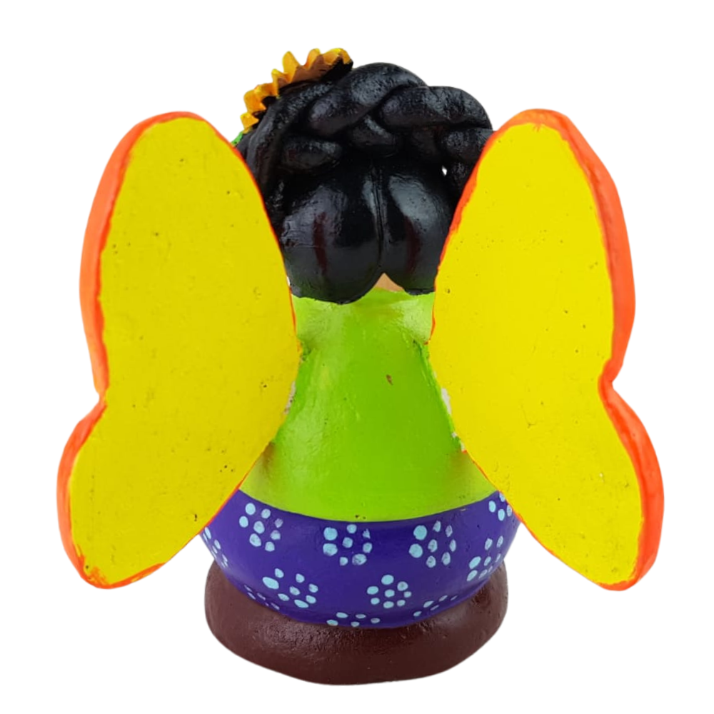 Muñequita mariposa lectora hecha de barro policromado frío