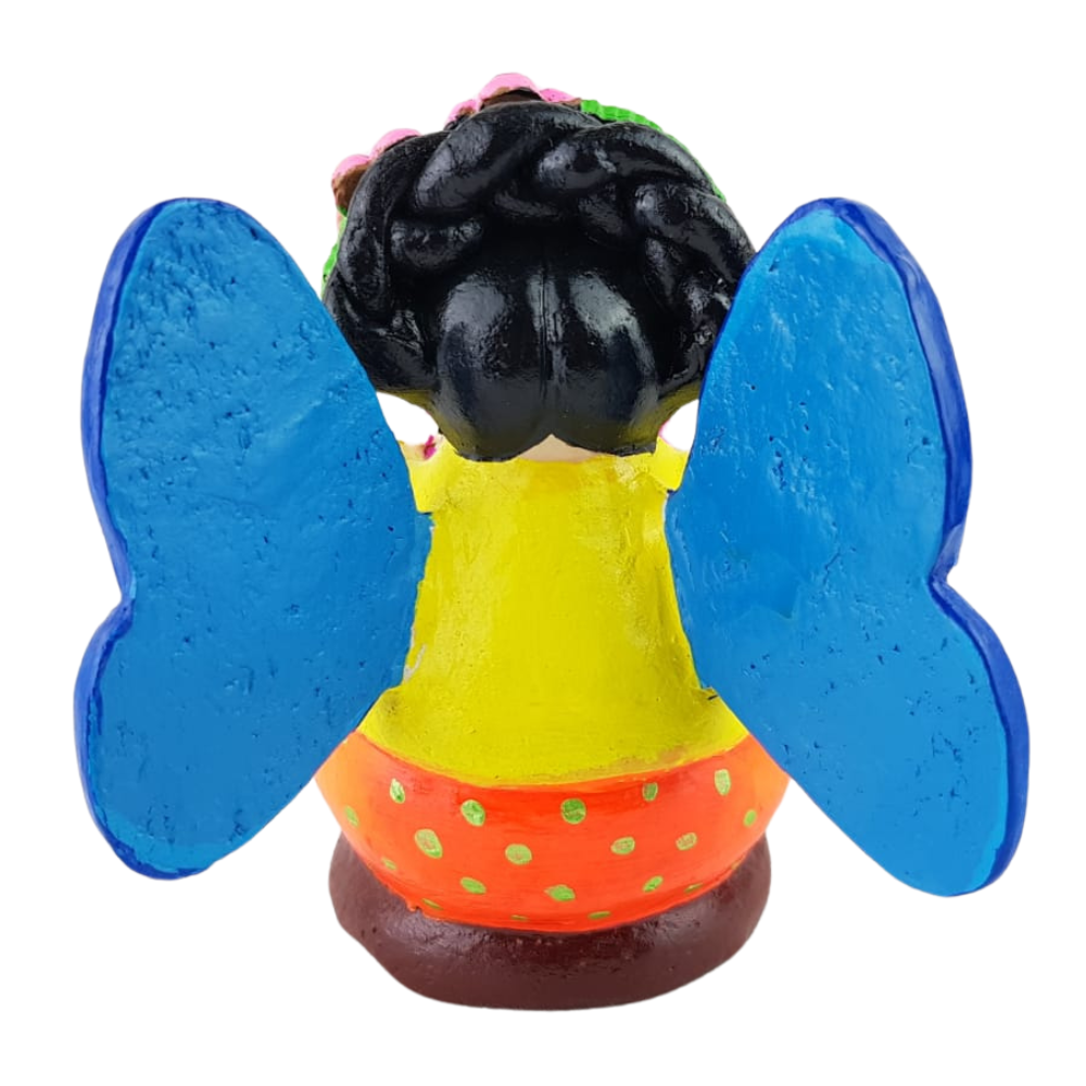 Muñequita mariposa lectora hecha de barro policromado frío