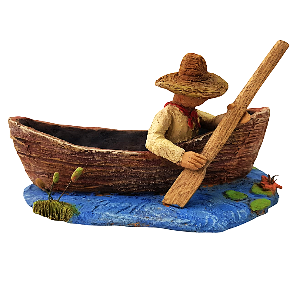 Maceta de barro con forma de canoa hecha por Norma Ramírez