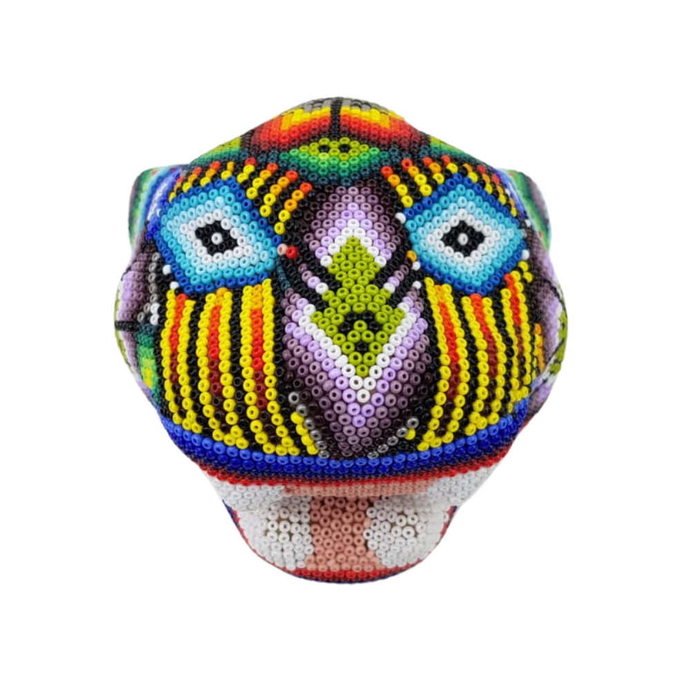 Cabeza de jaguar mediana hecha de papel maché con motivos wixárika
