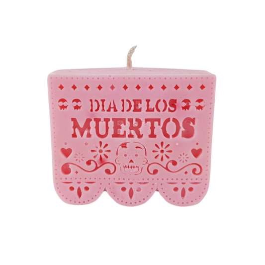 Vela para día de muertos, con forma de calaverita, flor de cempasúchil o papel picado