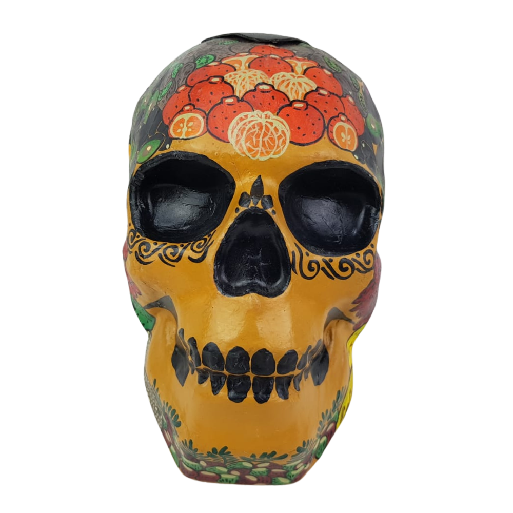 Alcancía con forma de cráneo elaborada con papel maché