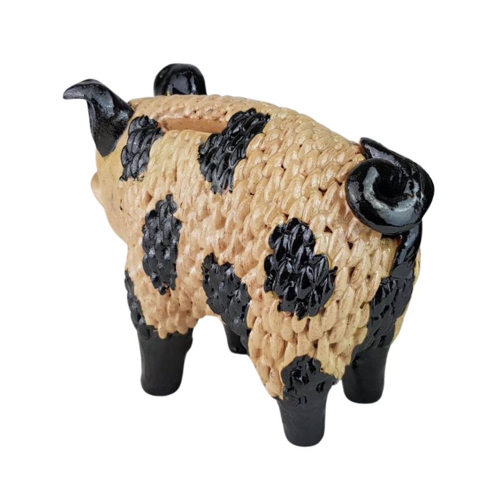 Alcancía en forma cerdito elaborada a mano con la técnica de barro vidriado