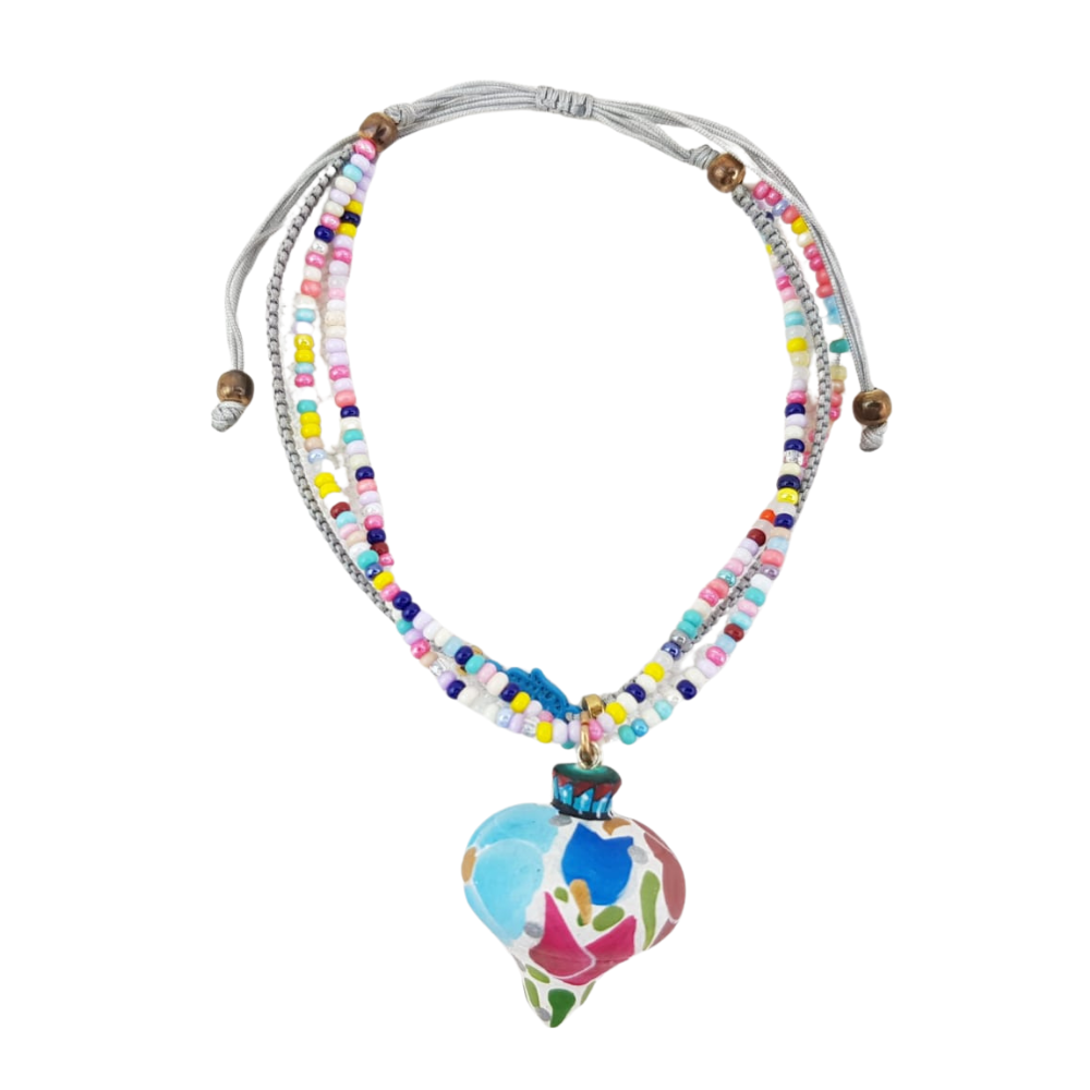 Pulsera con corazón o trompo de madera copal tallado y decorado a mano