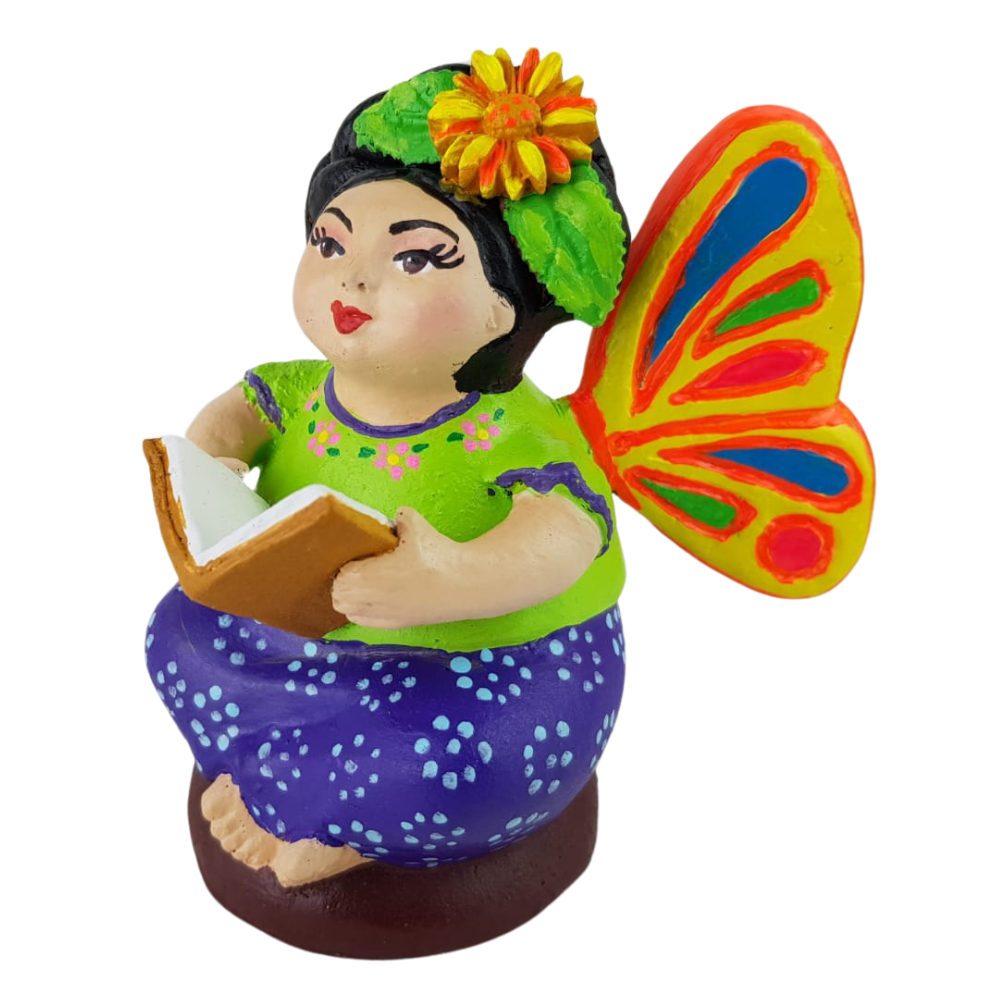 Muñequita mariposa lectora hecha de barro policromado frío