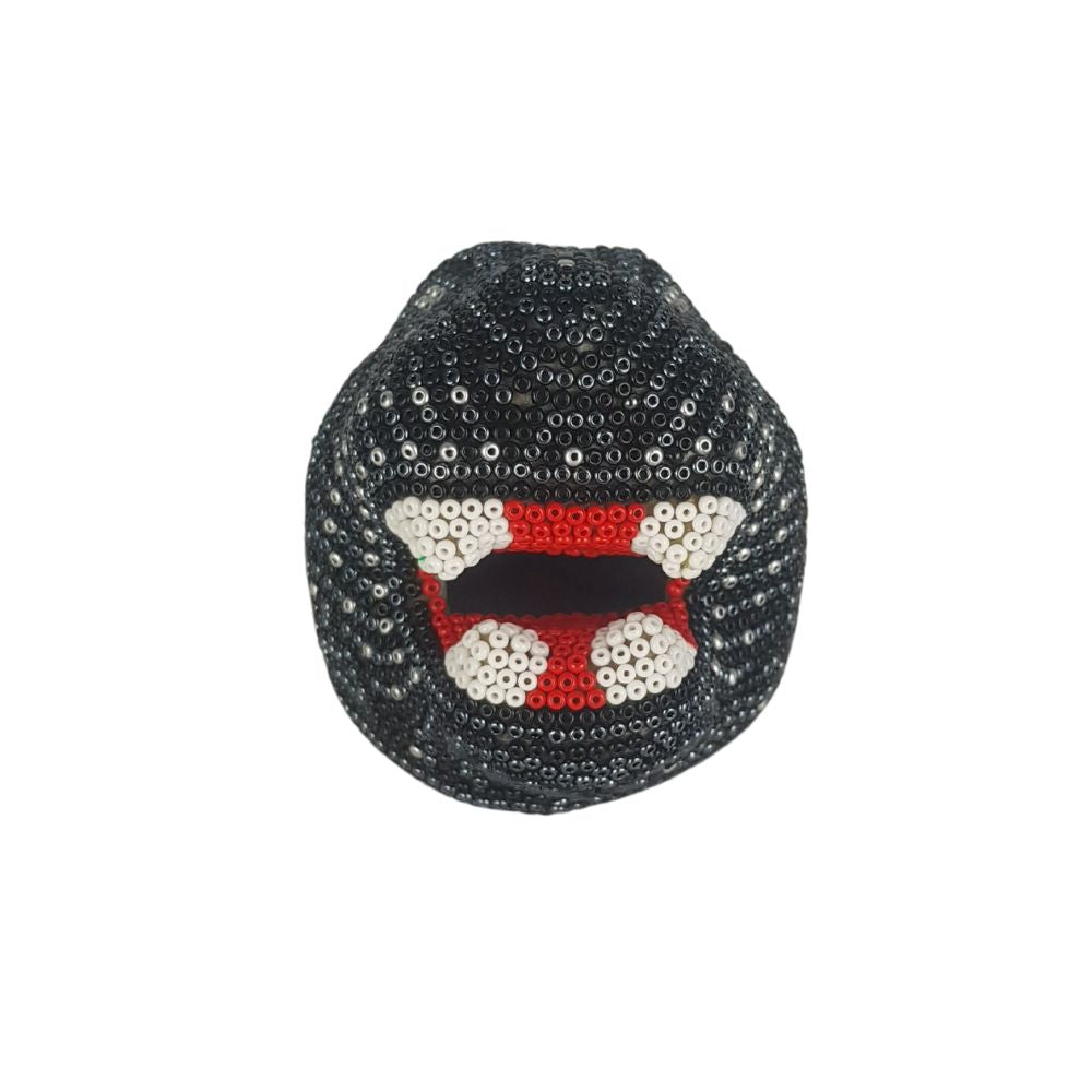 Cabeza de jaguar hecha de papel maché con motivos Wixárica