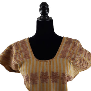 Huipil Hermina, textil mixteco de telar decorado con brocados, teñido con tintes naturales
