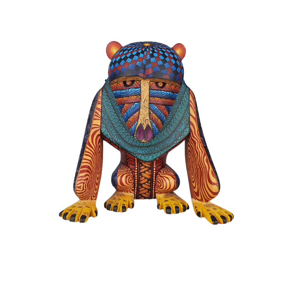 Alebrije mandril tallado en madera copal decorado con simbolismo zapoteca