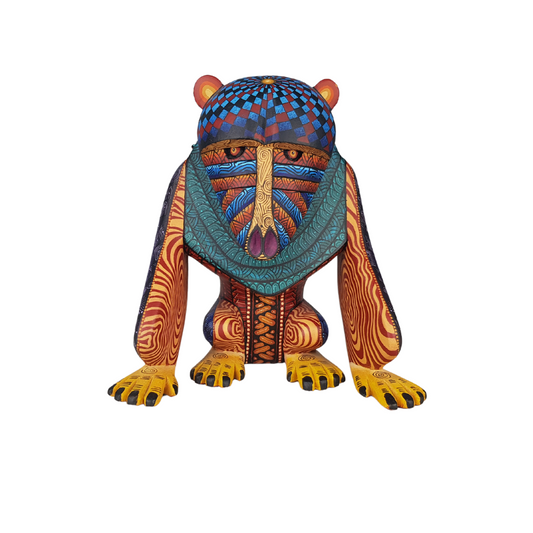 Alebrije mandril tallado en madera copal decorado con simbolismo zapoteca