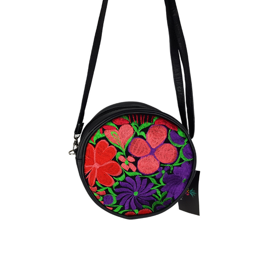 Bolsa redonda de piel con textil artesanal