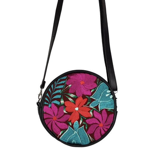 Bolsa redonda de piel con textil artesanal